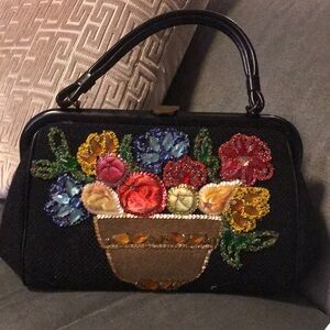 Elegant Black Floral Shoulder Bag with Intricate Design